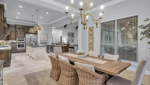 a kitchen with stainless steel appliances granite countertop a sink refrigerator and cabinets