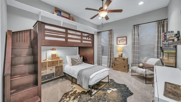 a bedroom with a bed and a table