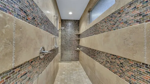 a bedroom with a bed and a chair