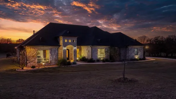 a view of road with large trees