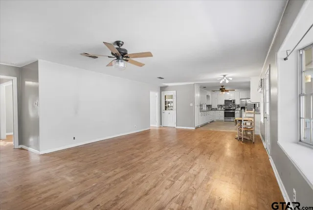 a view of a kitchen with a sink and cabinets