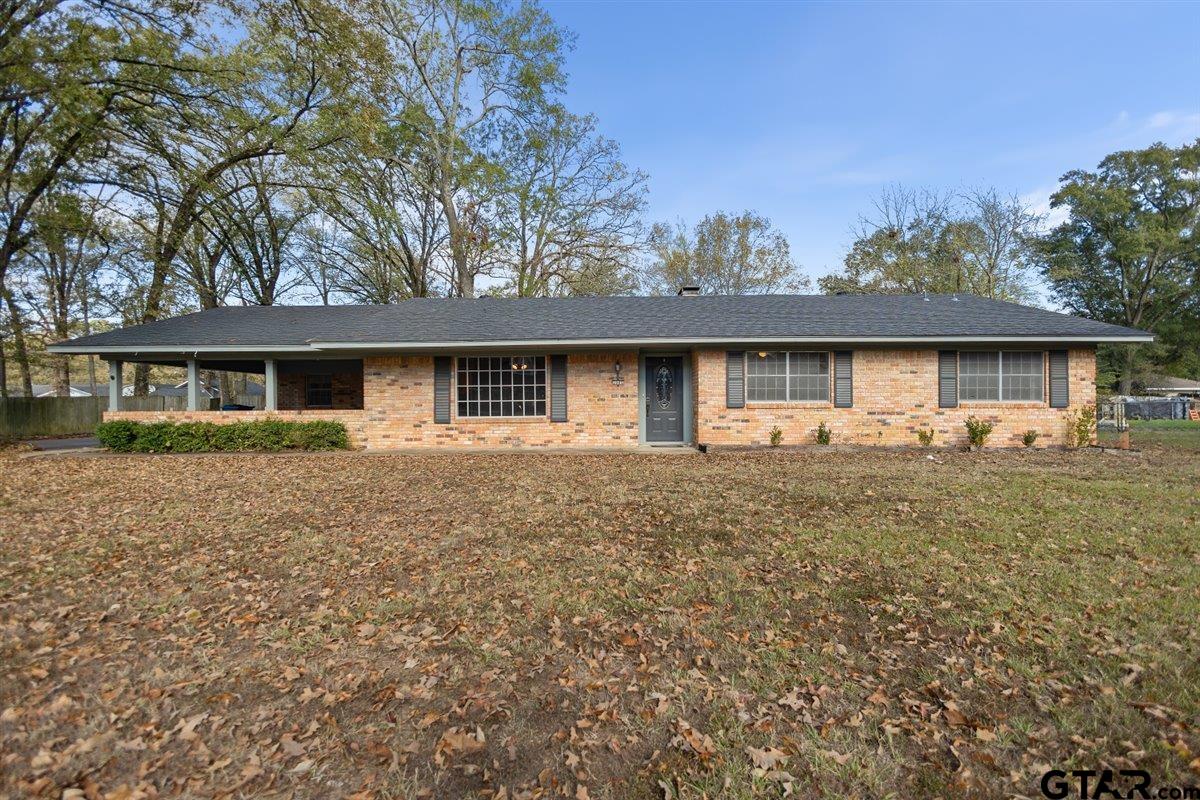 2005 Happy Street Mount Pleasant, TX 75455 - Photo 2 of 41 front view of a house with a yard