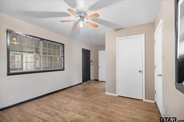 a view of backyard of house with green space