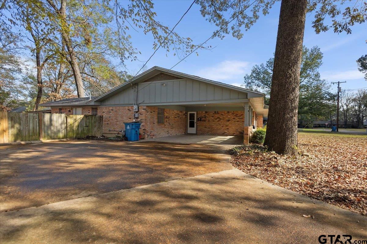 2005 Happy Street Mount Pleasant, TX 75455 - Photo 3 of 41 a front view of a house with garden