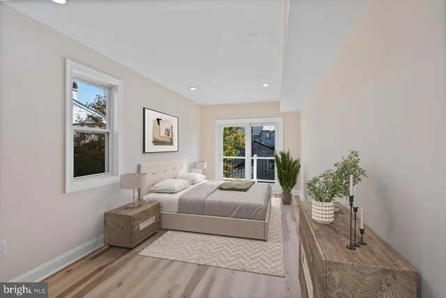 a living room with furniture potted plant and a window