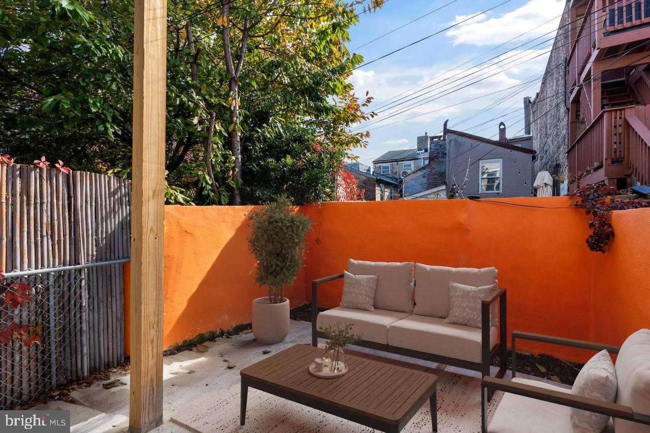 919 Stiles Street Baltimore, MD 21202 - Photo 24 of 36 a terrace of a house with outdoor seating