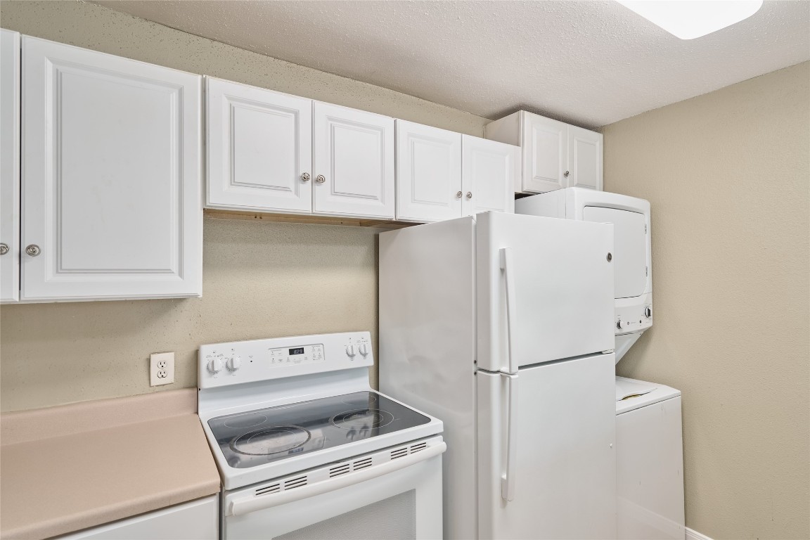 16120 Stuebner Airline Road, Unit 212 Spring, TX 77379 - Photo 15 of 29 a white refrigerator freezer sitting inside of a kitchen