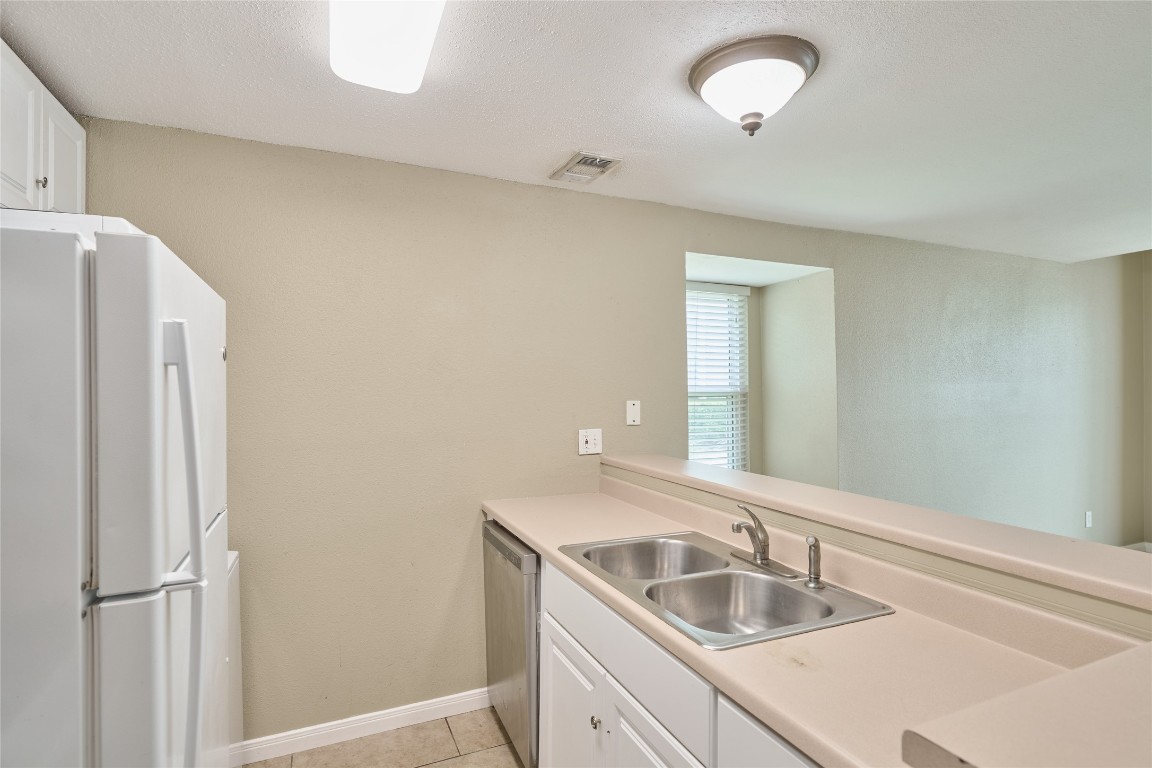 16120 Stuebner Airline Road, Unit 212 Spring, TX 77379 - Photo 16 of 29 a bathroom with a sink and a mirror