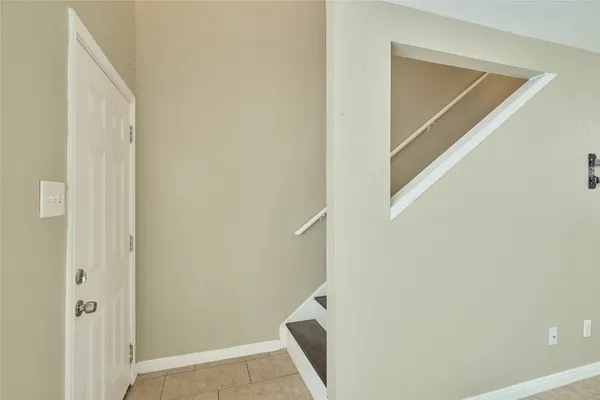 a view of hallway with wooden floor