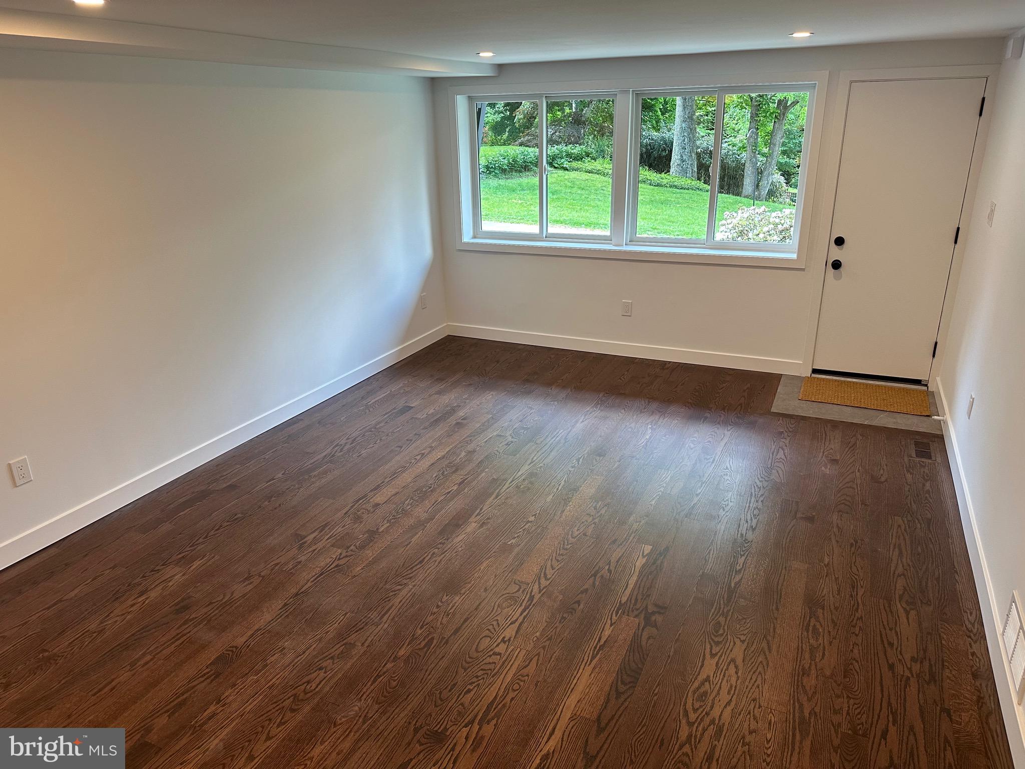 713 Woodfield Road Villanova, PA 19085 - Photo 27 of 36 wooden floor in an empty room with a window