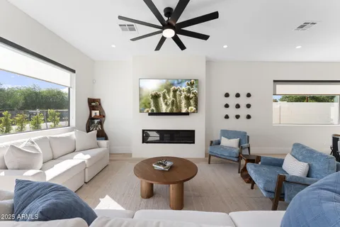 a living room with furniture and a large window
