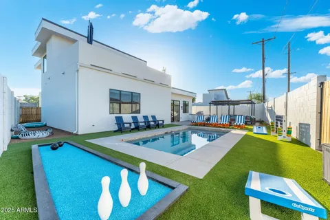 a view of a dining room kitchen with furniture and a swimming pool