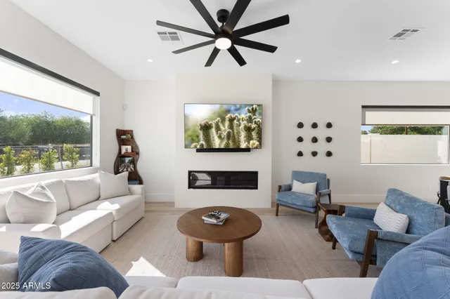 a living room with furniture and a large window