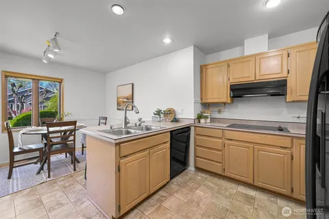 a kitchen with a sink and cabinets