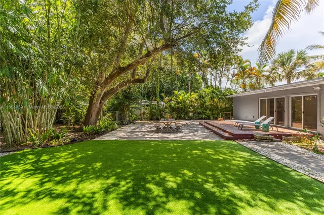 a view of a backyard with a small cabin