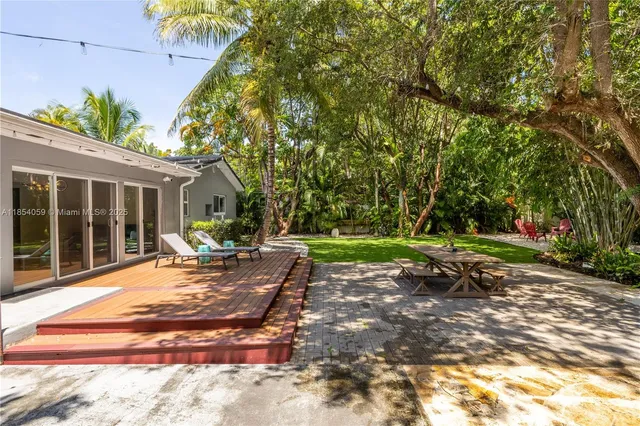 a house view with a seating space and garden
