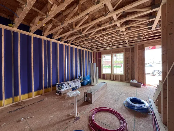 a bed room with two beds and a wooden floor
