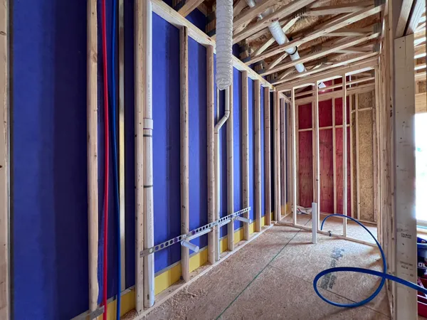 a view of empty room with wooden walls