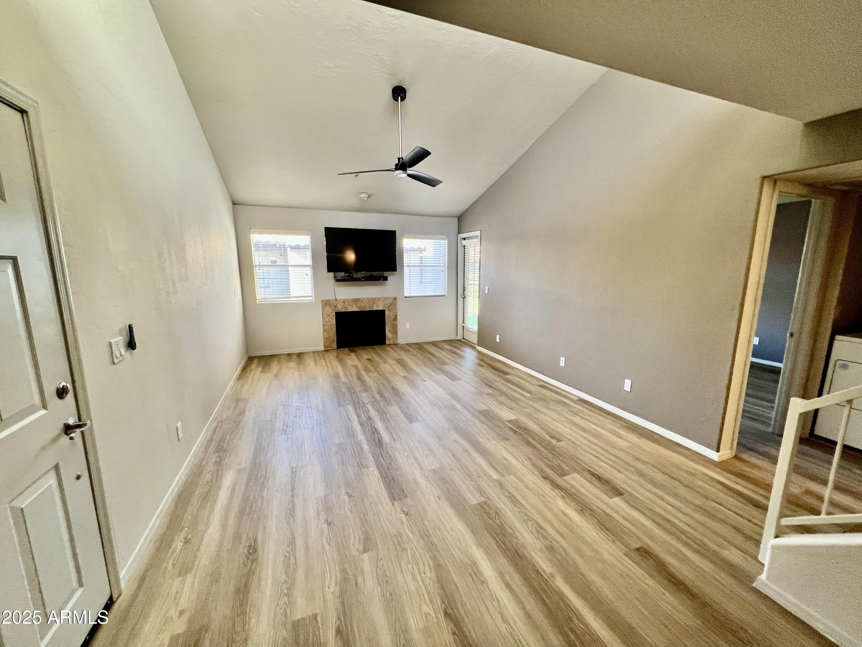 14145 North 92nd Street, Unit 2101 Scottsdale, AZ 85260 - Photo 11 of 30 a view of a kitchen with a sink and wooden floor