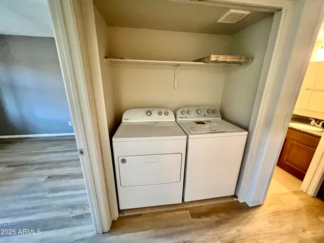 a bathroom with a granite countertop sink toilet a large mirror a bathtub and shower