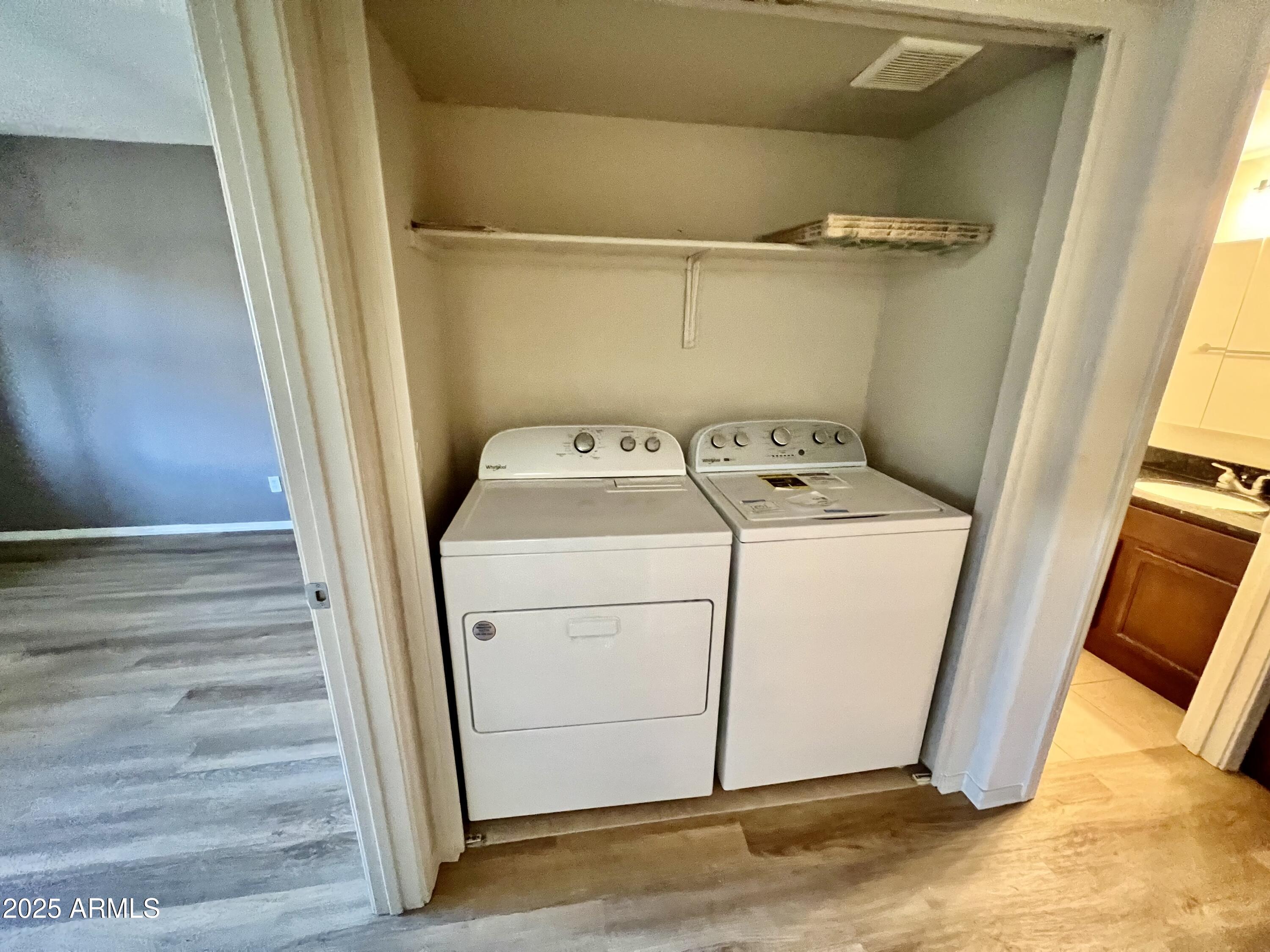 14145 North 92nd Street, Unit 2101 Scottsdale, AZ 85260 - Photo 17 of 30 a utility room with dryer and washer