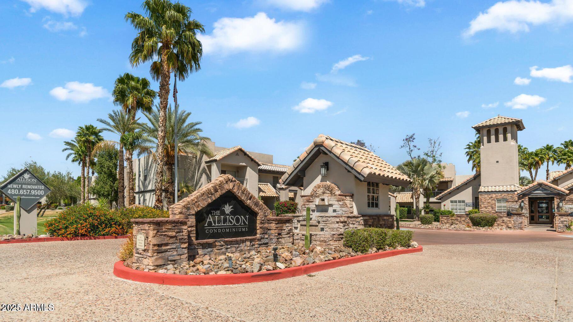 14145 North 92nd Street, Unit 2101 Scottsdale, AZ 85260 - Photo 2 of 30 a front view of a house with a yard and garage