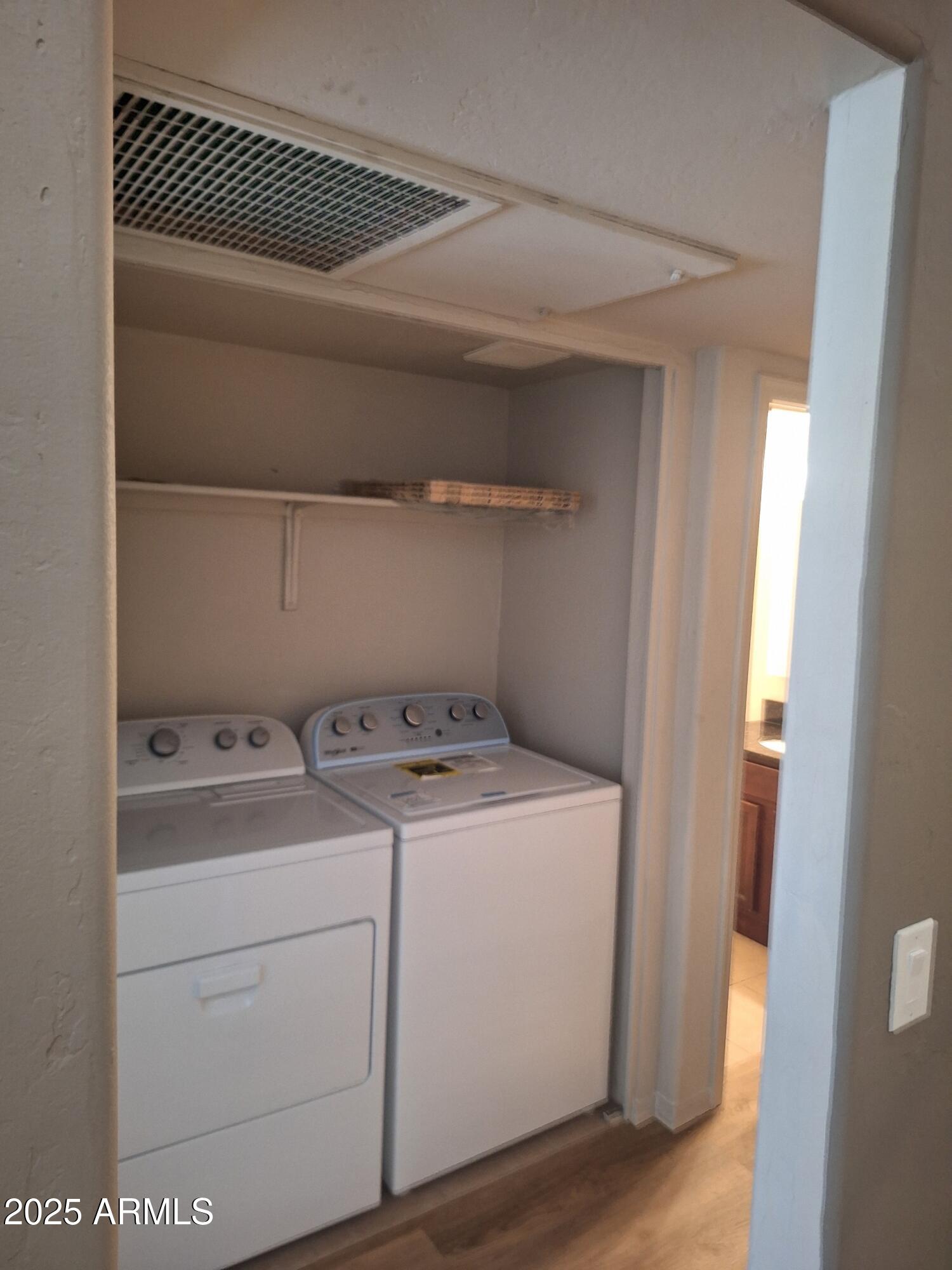 14145 North 92nd Street, Unit 2101 Scottsdale, AZ 85260 - Photo 22 of 30 a utility room with dryer and washer