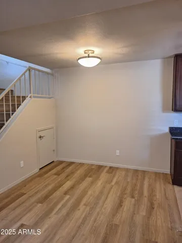 a view of an entryway with wooden floor