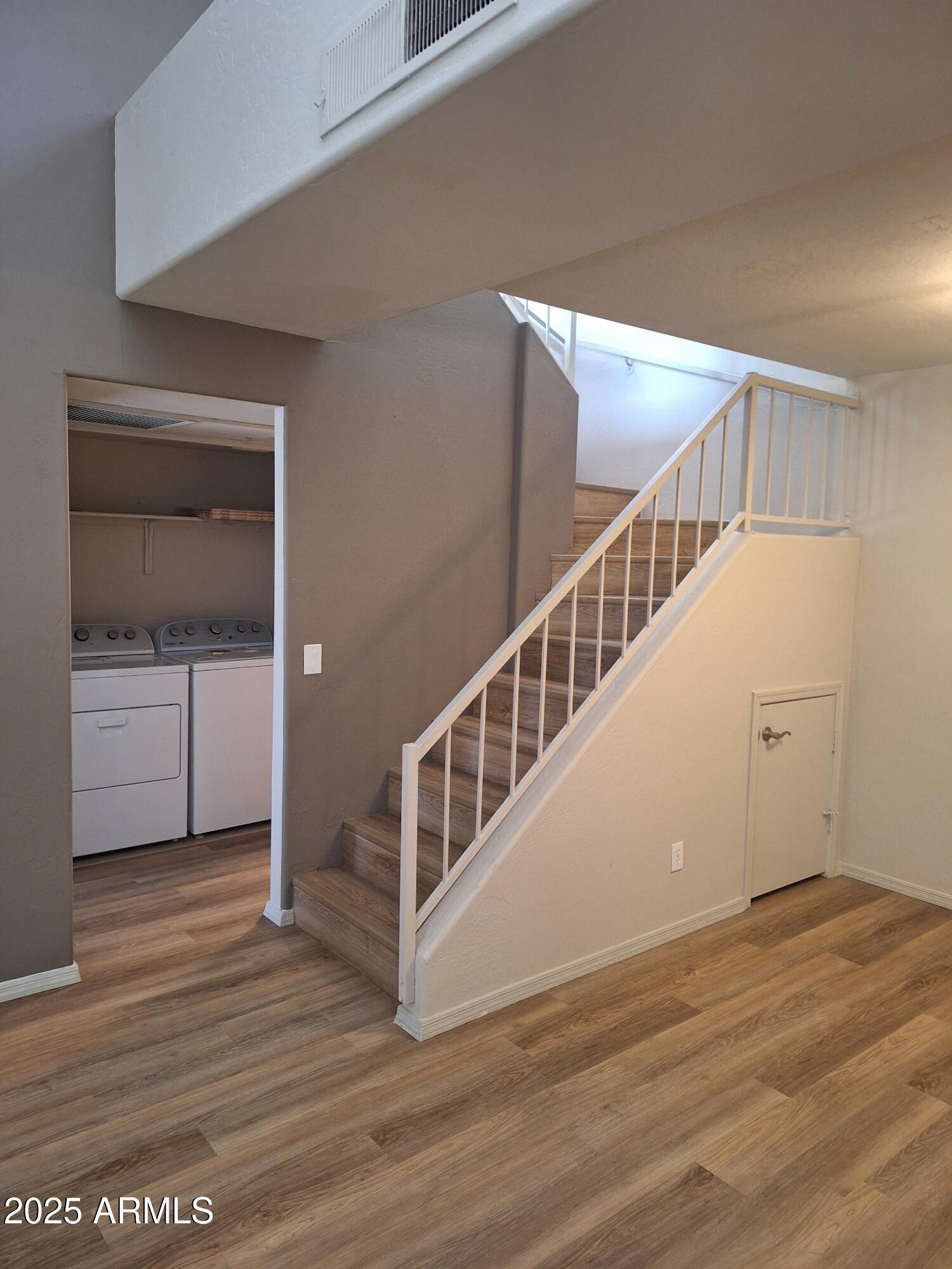 14145 North 92nd Street, Unit 2101 Scottsdale, AZ 85260 - Photo 26 of 30 a view of an entryway with wooden floor