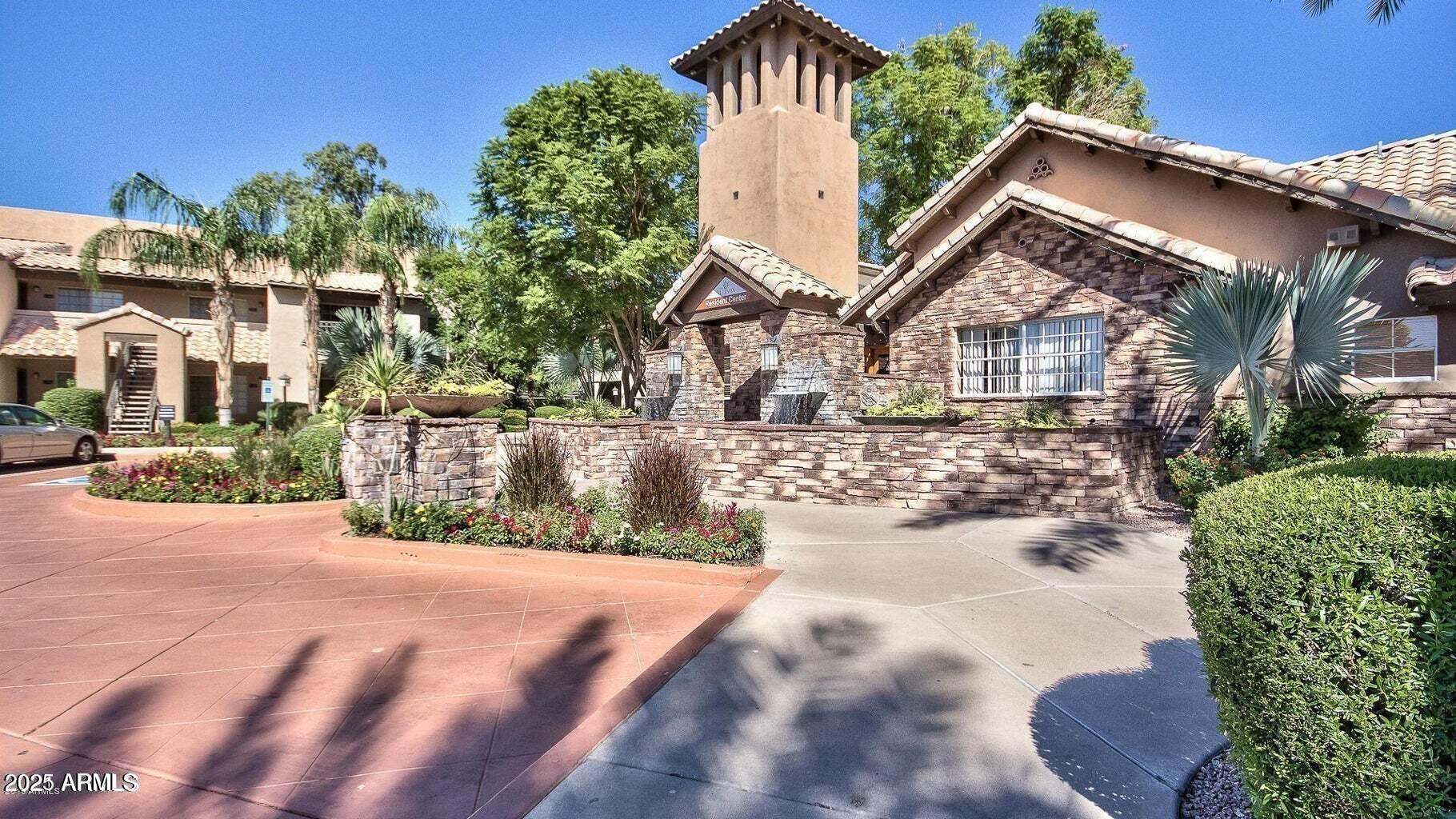 14145 North 92nd Street, Unit 2101 Scottsdale, AZ 85260 - Photo 3 of 30 a view of a house with a yard
