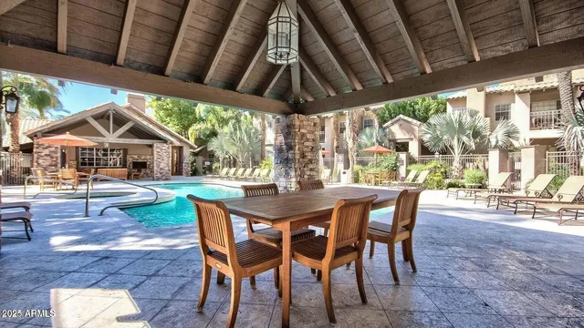 a view of an outdoor space with a table and chairs