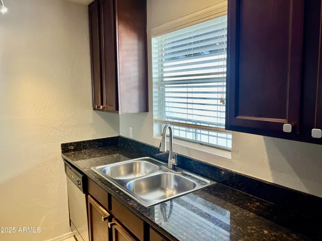 a kitchen with stainless steel appliances a stove a microwave and a refrigerator