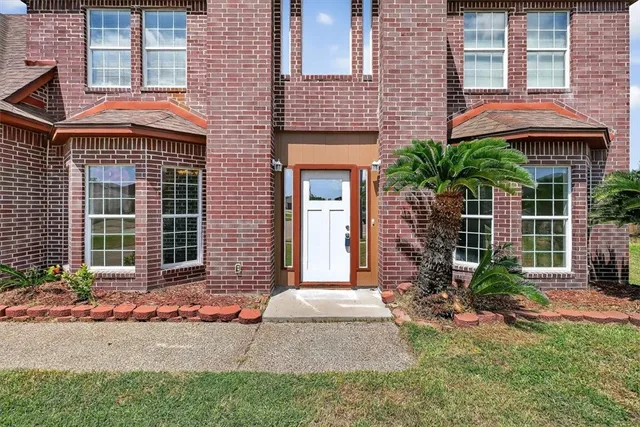 a front view of a house having yard