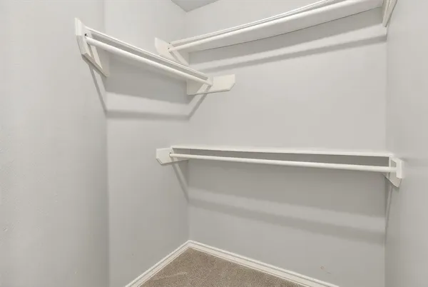 a view of an empty walk in closet