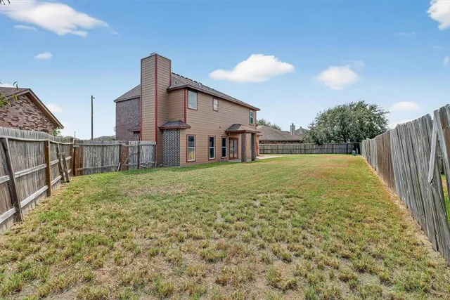 a house view with swimming pool in front of it
