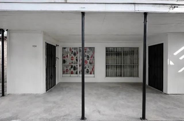 a view of a hallway with wooden shelves