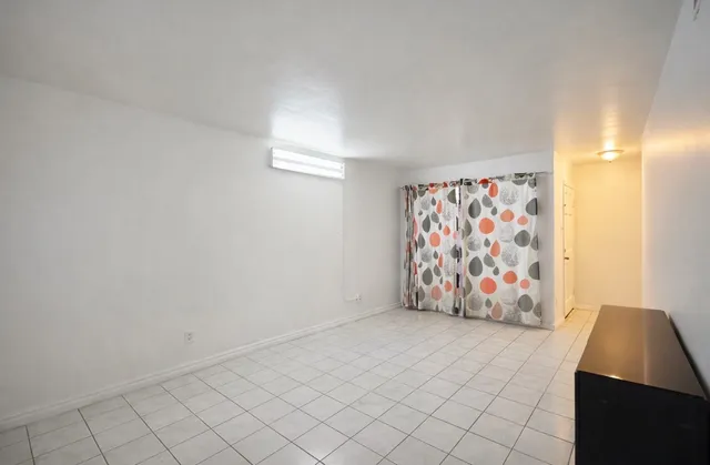 a kitchen with a sink a stove and refrigerator