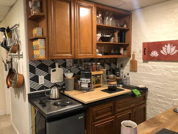 a kitchen with a sink and cabinets