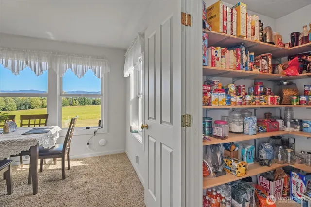 a view of a livingroom with lots of furniture and toys