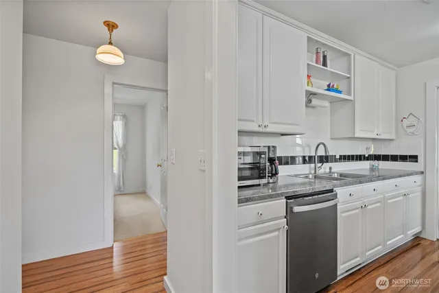 a kitchen with cabinets and appliances