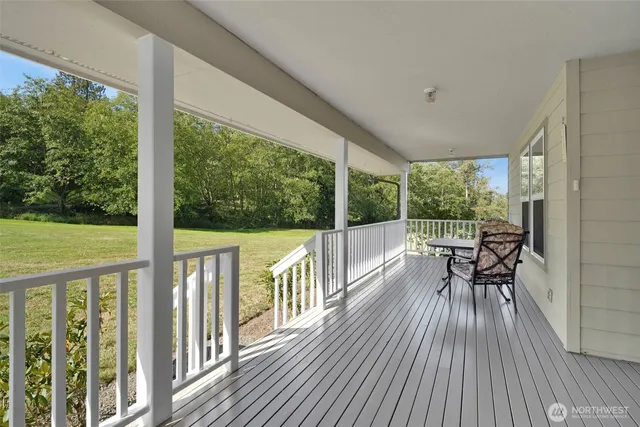 a view of balcony with wooden floor and outdoor space