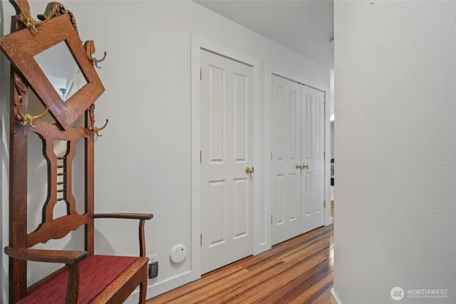 a view of an entryway with wooden floor