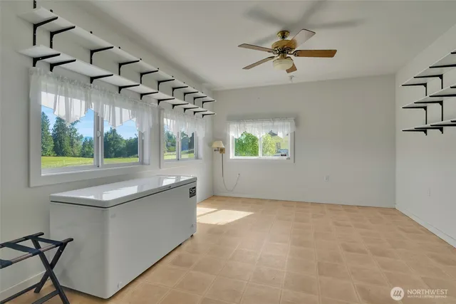 an empty room with windows and entrance