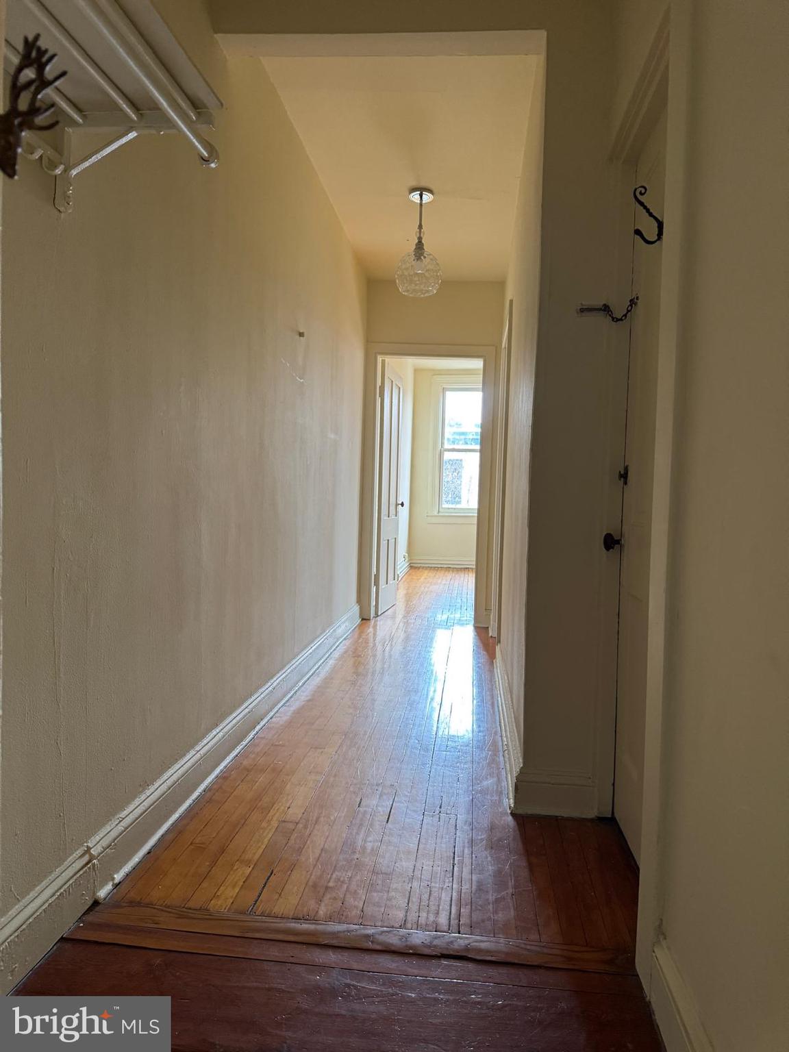 230 West Lafayette Avenue, Unit 3 Baltimore, MD 21217 - Photo 11 of 19 a view of a hallway with wooden floor