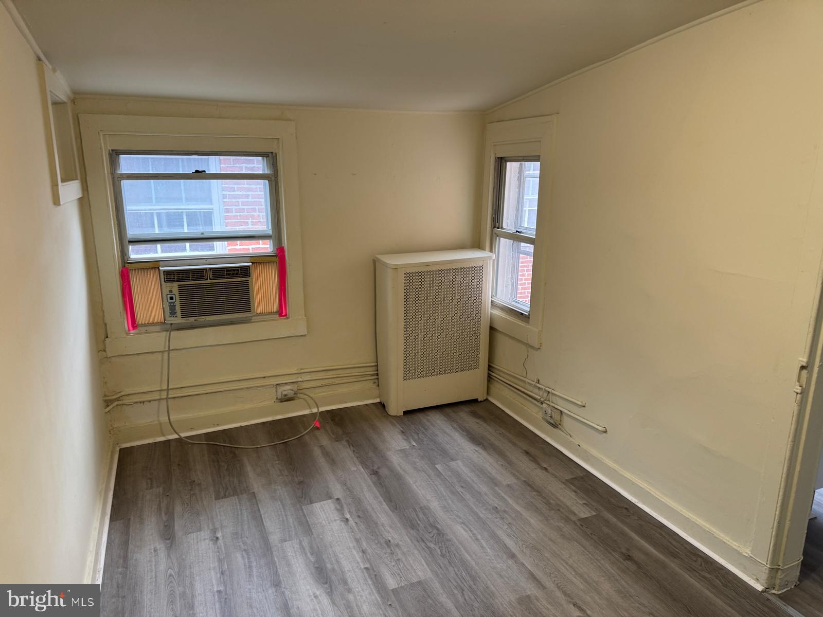 230 West Lafayette Avenue, Unit 3 Baltimore, MD 21217 - Photo 14 of 19 a view of an empty room and wooden floor and a window