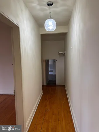 a view of a hallway with a chandelier