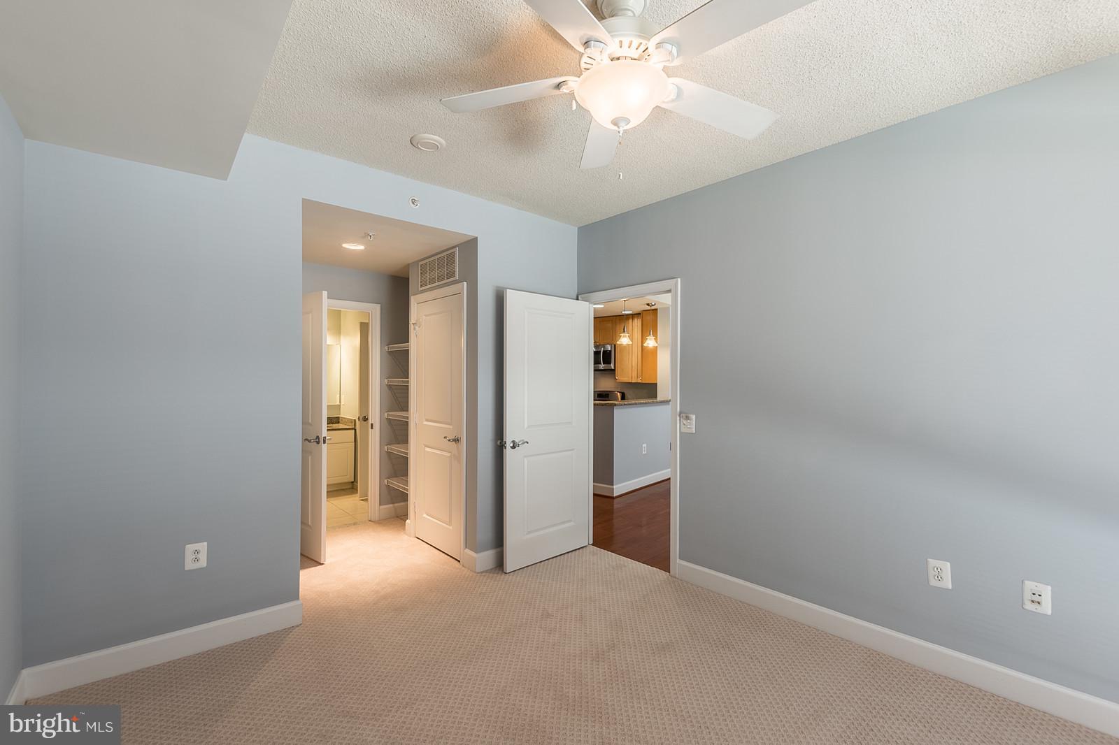 3600 South Glebe Road, Unit 227W Arlington, VA 22202 - Photo 15 of 29 an empty room with a bathroom and a mirror