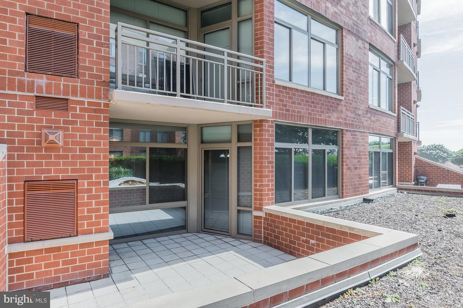3600 South Glebe Road, Unit 227W Arlington, VA 22202 - Photo 21 of 29 a view of a brick building with large windows