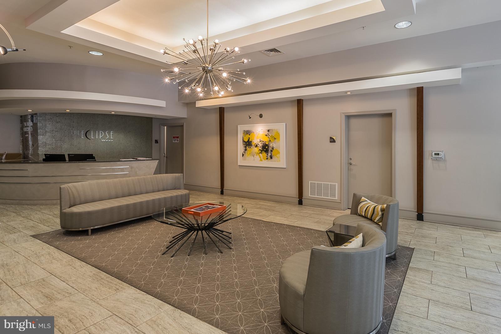3600 South Glebe Road, Unit 227W Arlington, VA 22202 - Photo 22 of 29 a living room with furniture and a chandelier