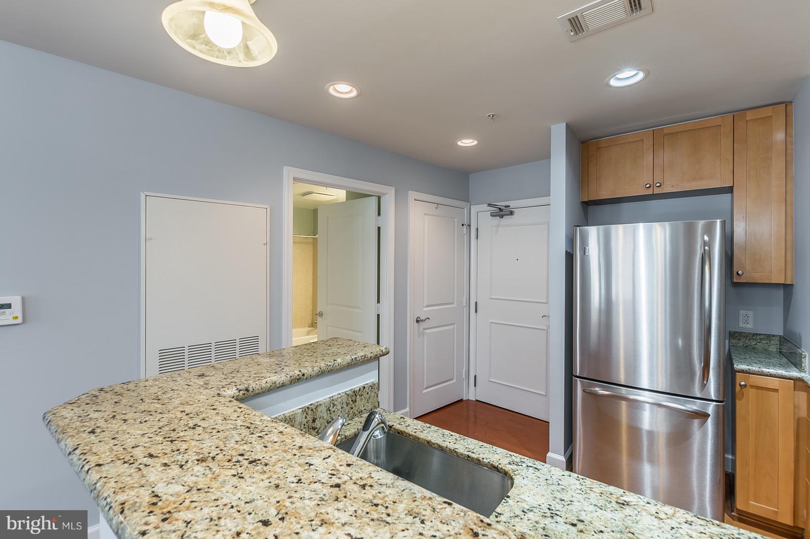 3600 South Glebe Road, Unit 227W Arlington, VA 22202 - Photo 4 of 29 a kitchen with a refrigerator and a sink